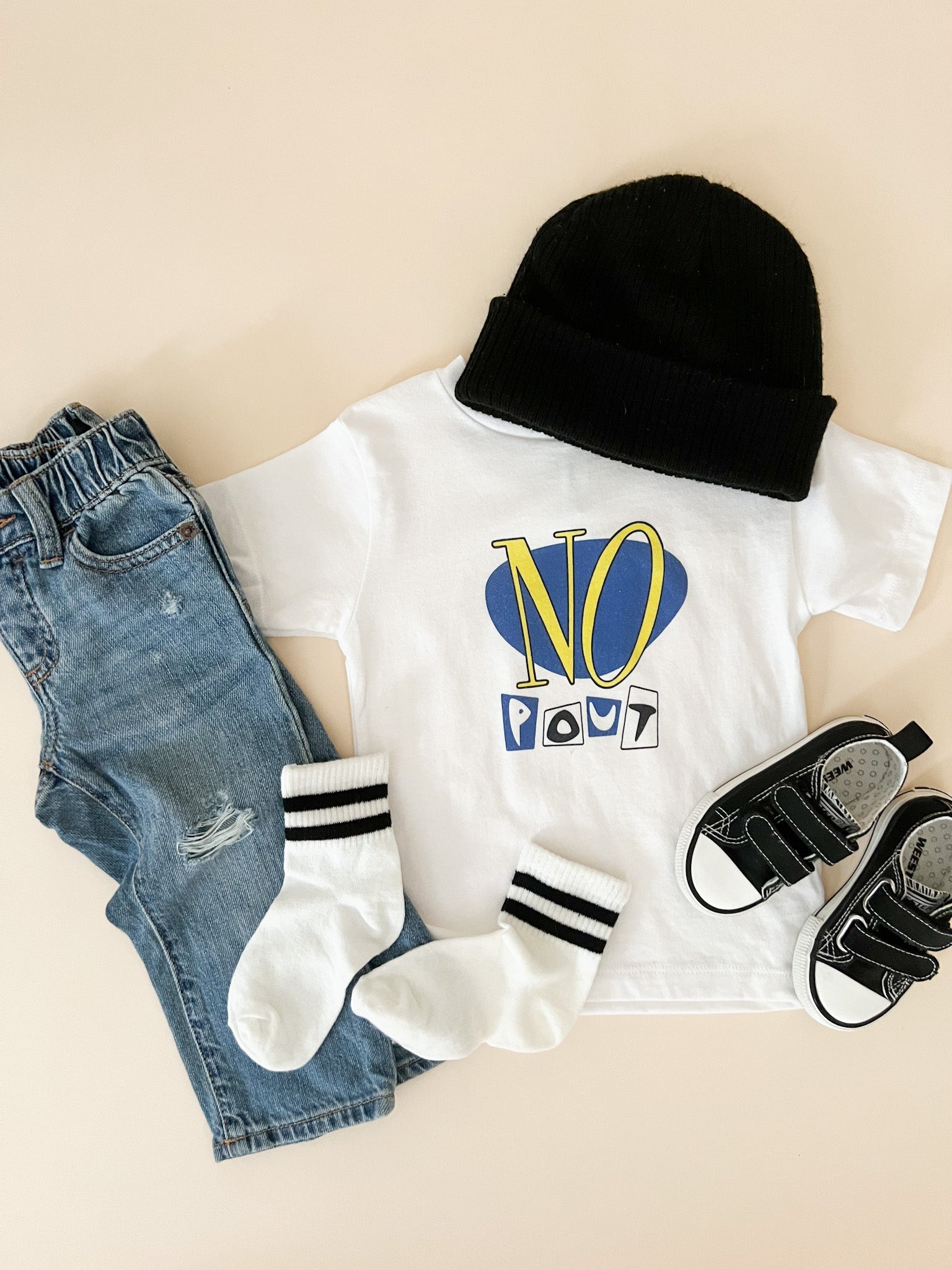 no pout toddler tee styled with jeans beanie and shoes