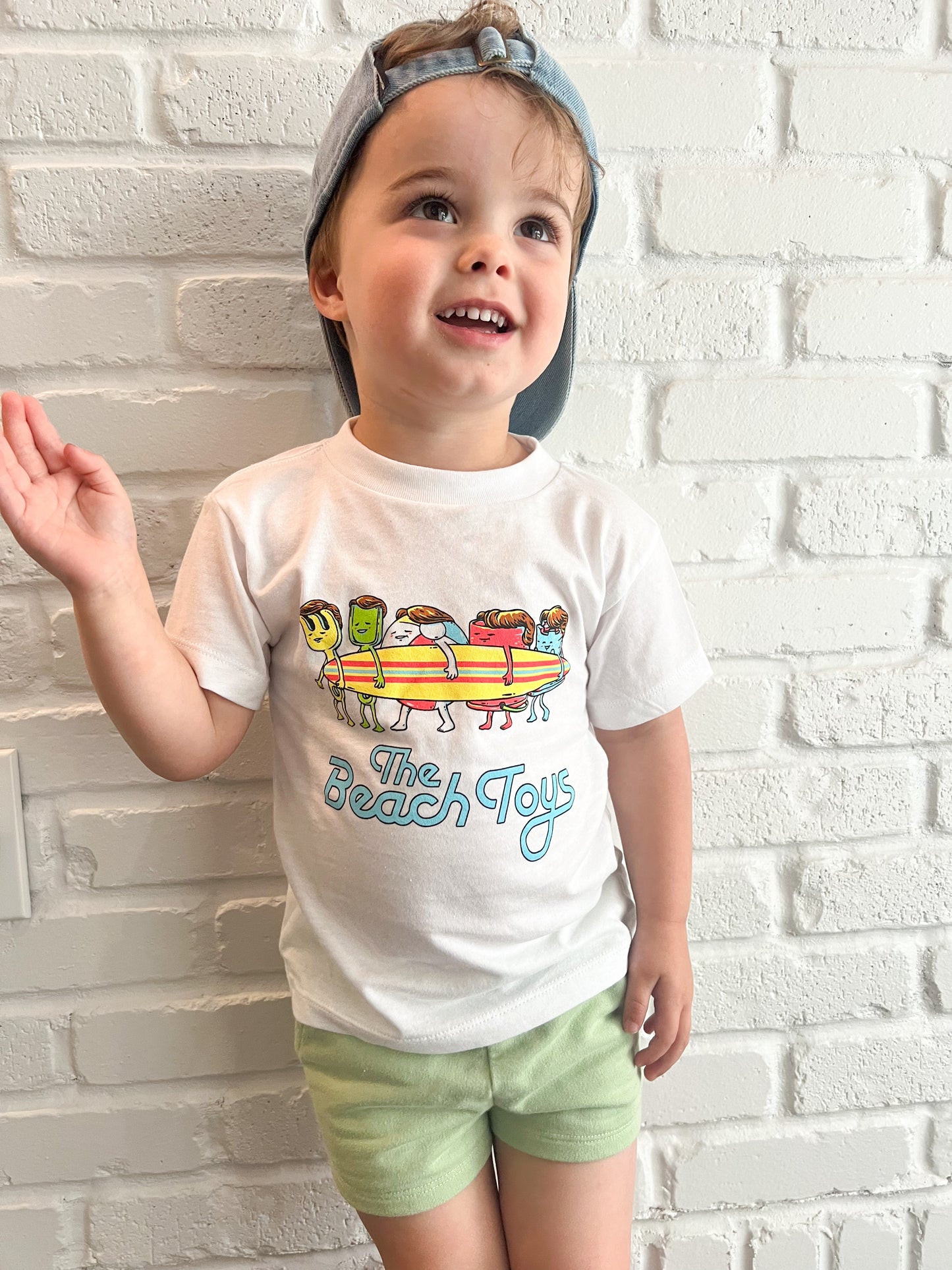 toddler wearing beach toys punny band tee